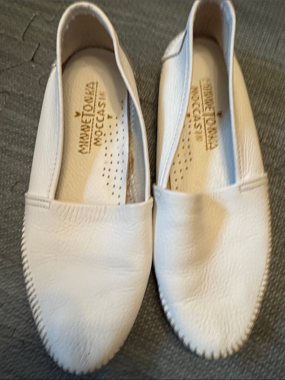 Minnetonka Cream Leather Slip-On Moccasins